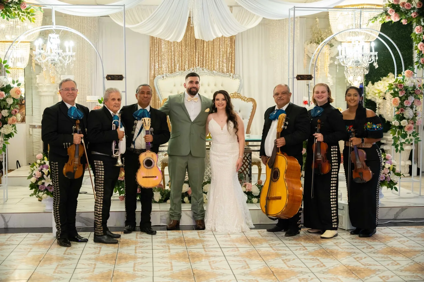 Bride and groom with mariachi band.