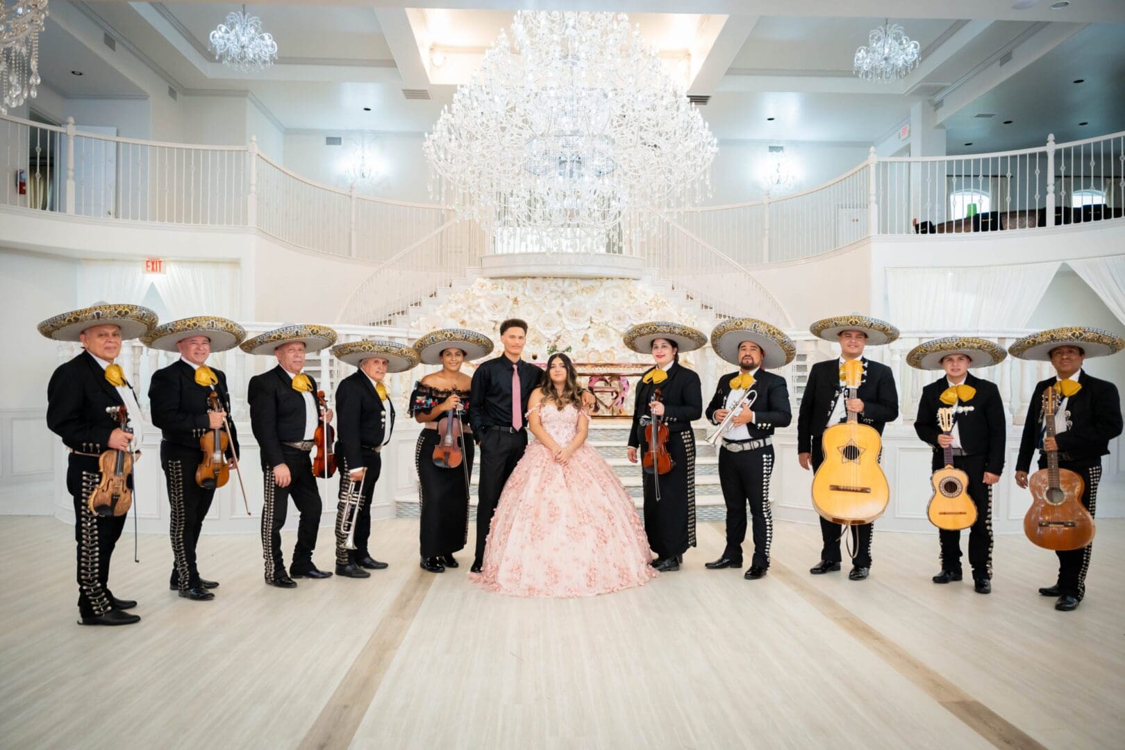 Quinceañera celebration with mariachi band indoors.