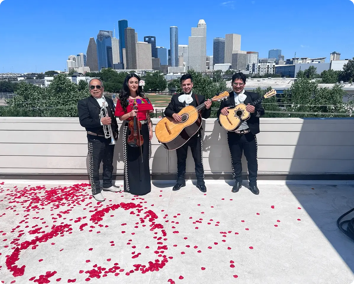 Mariachi band performing on rooftop, city skyline.